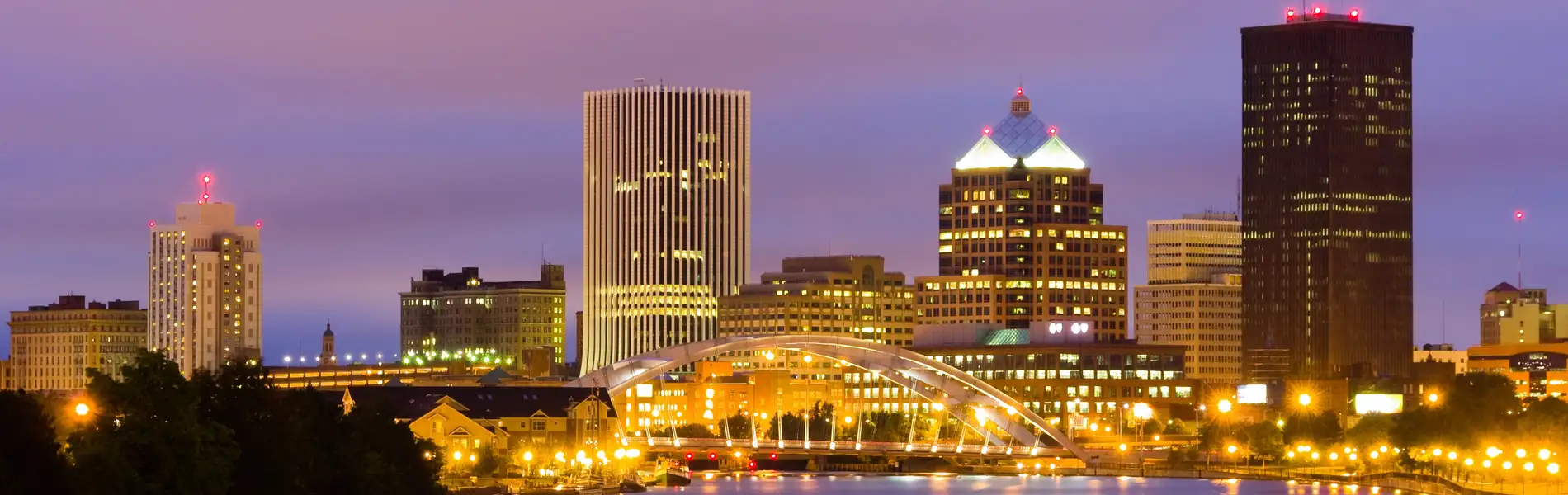 Neon color image of a band playing and people singing along