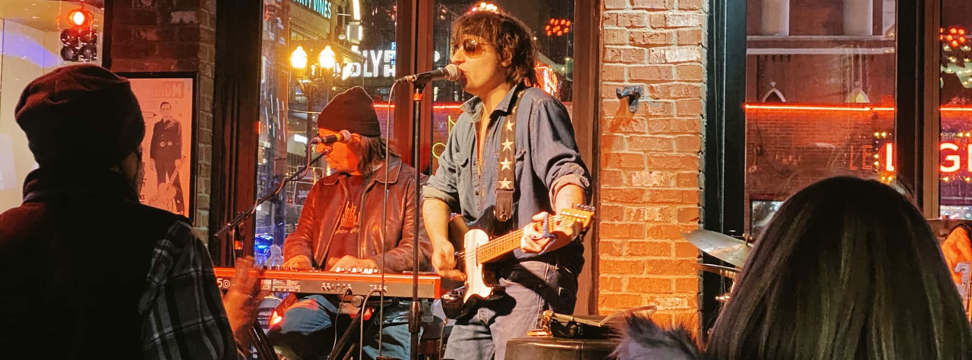 bar singer on guitar in Rochester